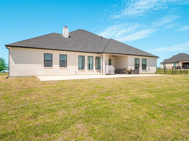 1515 Malone Dr, Royse City, TX 75189 - rear view of house with a lawn, a patio, roof with shingles, fence, and brick siding