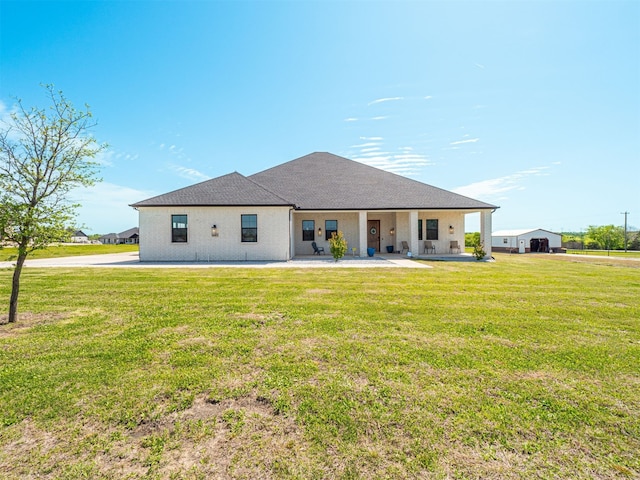 1515 Malone Dr, Royse City, TX 75189 - back of property with a shingled roof, a yard, and a patio area