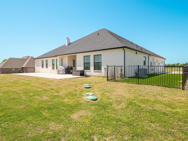 1515 Malone Dr, Royse City, TX 75189 - rear view of house with a yard, a patio, fence, brick siding, and a chimney