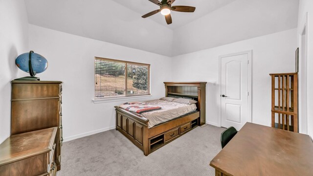 carpeted bedroom featuring baseboards, vaulted ceiling, and ceiling fan