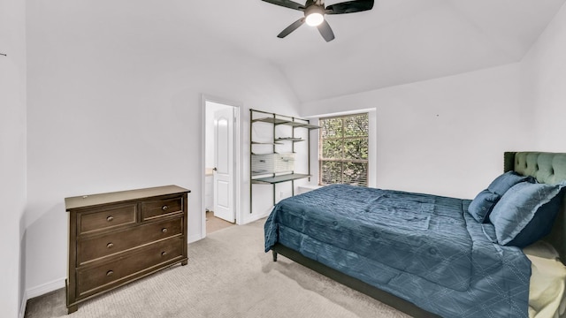 bedroom with baseboards, a ceiling fan, ensuite bath, vaulted ceiling, and light carpet