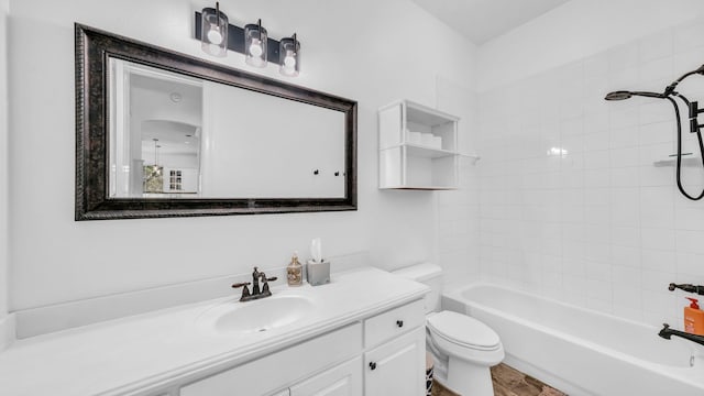 bathroom with vanity, shower / tub combination, toilet, and wood finished floors