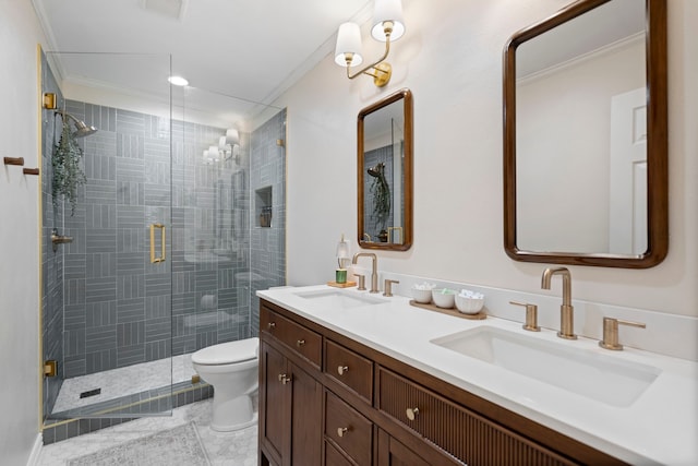 full bathroom featuring a shower stall, a sink, toilet, and crown molding