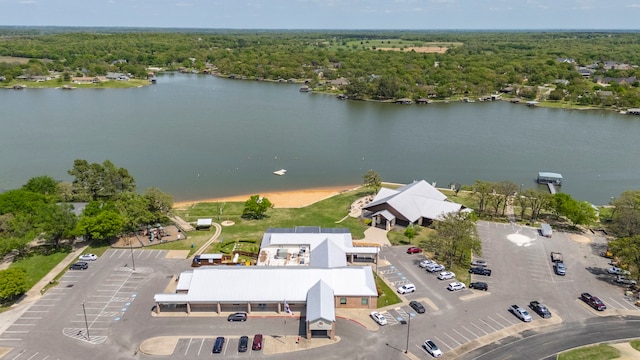 bird's eye view with a water view and a view of trees