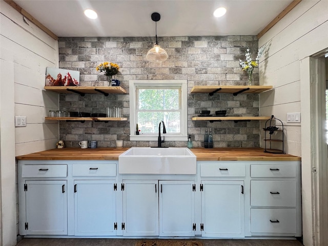 143 Lisa Layne St, Gun Barrel City, TX 75156 - kitchen with wood counters, a sink, open shelves, and pendant lighting