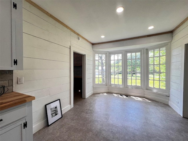 143 Lisa Layne St, Gun Barrel City, TX 75156 - unfurnished living room with wooden walls and recessed lighting