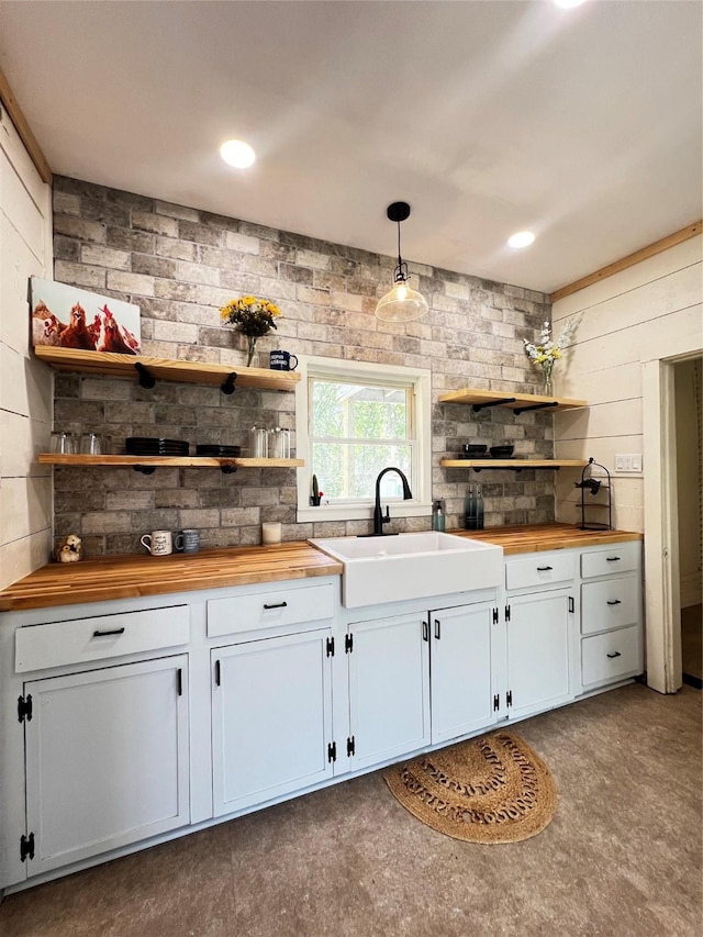 143 Lisa Layne St, Gun Barrel City, TX 75156 - kitchen featuring butcher block counters, open shelves, a sink, hanging light fixtures, and white cabinetry