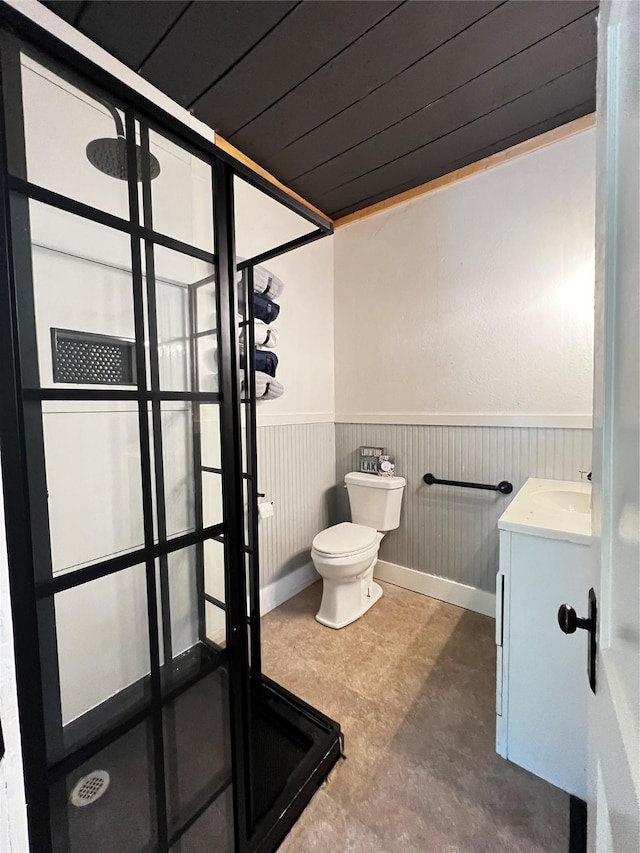 143 Lisa Layne St, Gun Barrel City, TX 75156 - full bathroom with vanity, a stall shower, a wainscoted wall, and toilet