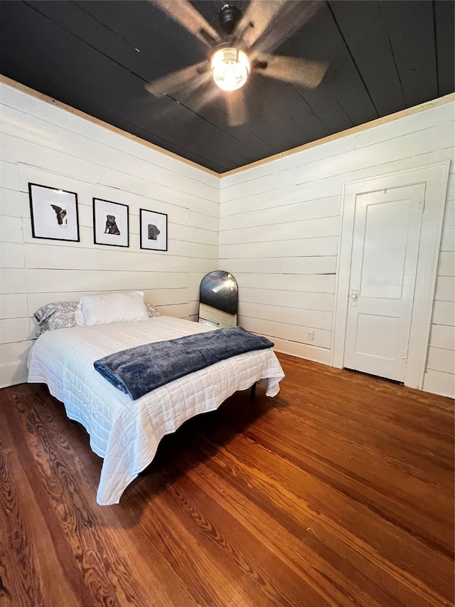 143 Lisa Layne St, Gun Barrel City, TX 75156 - bedroom featuring wood finished floors, wood walls, and ceiling fan