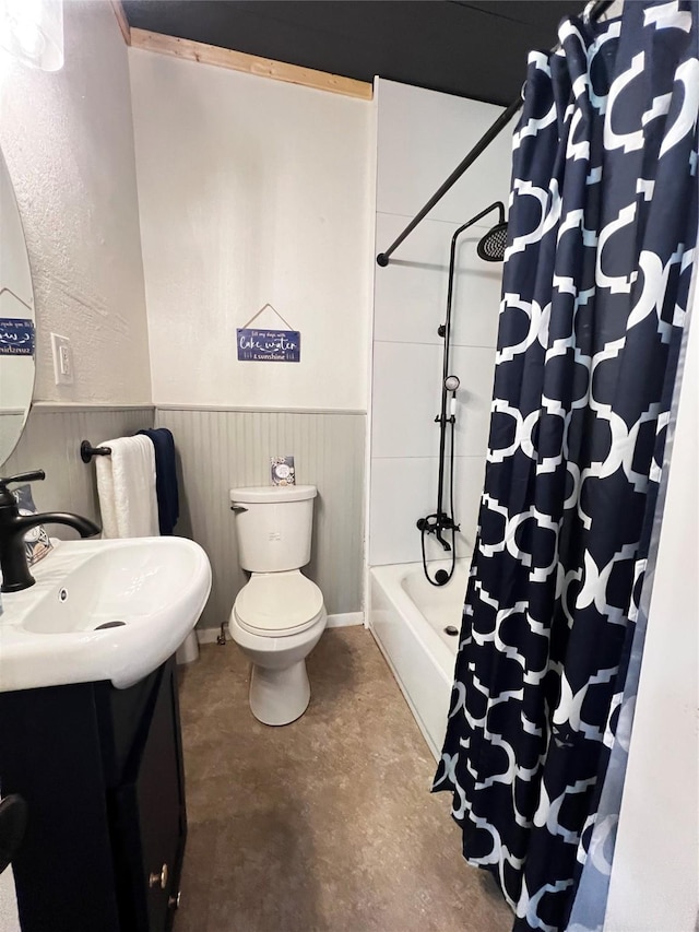 143 Lisa Layne St, Gun Barrel City, TX 75156 - bathroom featuring finished concrete floors, vanity, a wainscoted wall, toilet, and shower / bath combination with curtain