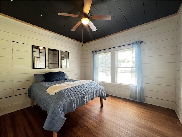 143 Lisa Layne St, Gun Barrel City, TX 75156 - bedroom with wooden walls, wood finished floors, wooden ceiling, and a ceiling fan