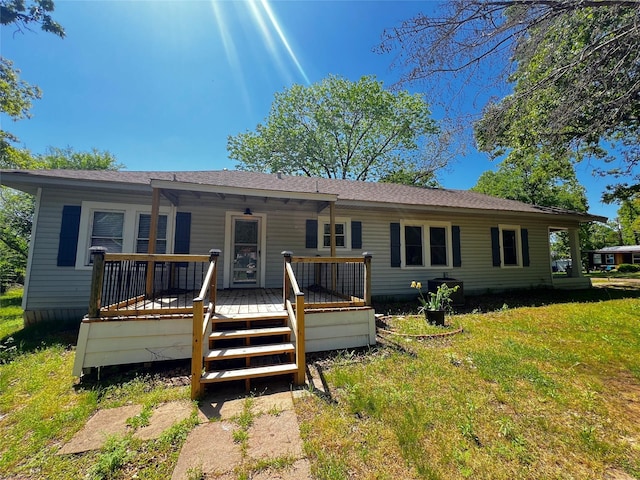 143 Lisa Layne St, Gun Barrel City, TX 75156 - back of house featuring a wooden deck and a lawn