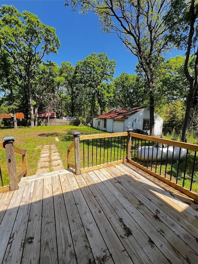 143 Lisa Layne St, Gun Barrel City, TX 75156 - wooden deck featuring a lawn, an outbuilding, and view of wooded area