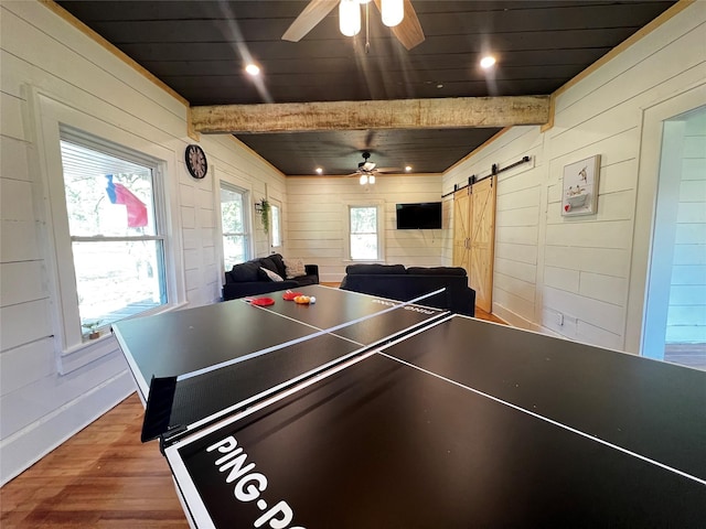 143 Lisa Layne St, Gun Barrel City, TX 75156 - game room featuring a ceiling fan, wooden walls, wood finished floors, a barn door, and beamed ceiling