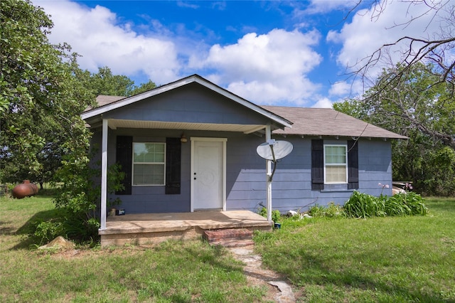 view of front of property with a front yard and a porch