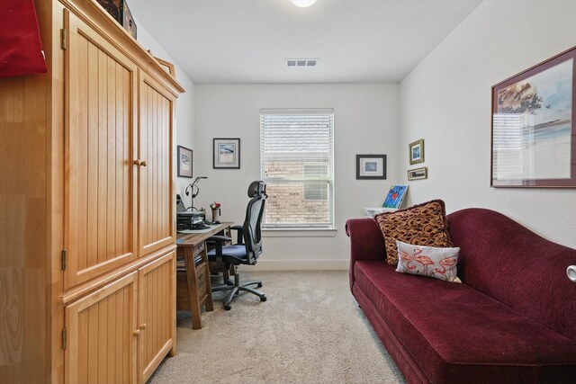 office with light carpet, visible vents, and baseboards
