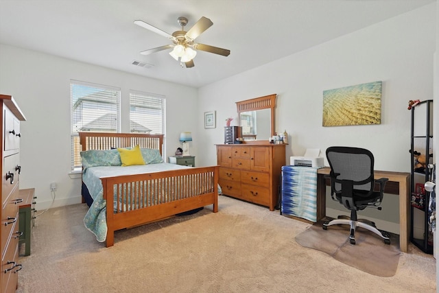 carpeted bedroom featuring baseboards, a ceiling fan, multiple windows, and visible vents