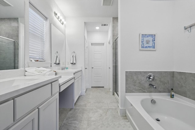 bathroom with a bath, a shower stall, and visible vents