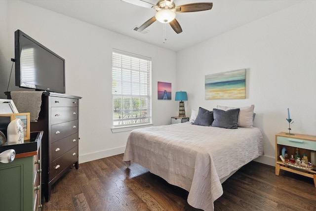 bedroom with ceiling fan, baseboards, dark wood-type flooring, and visible vents