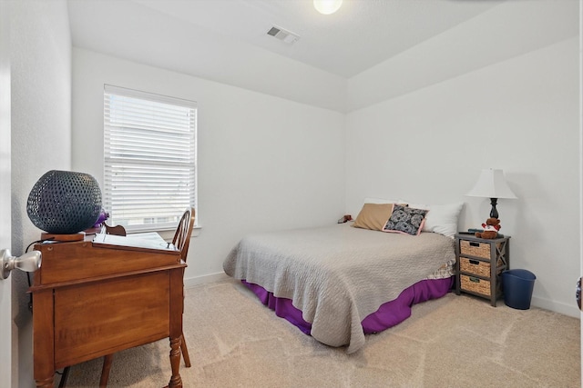 bedroom featuring baseboards, visible vents, and carpet flooring