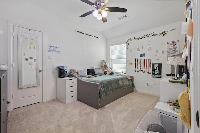 bedroom featuring carpet flooring, vaulted ceiling, visible vents, baseboards, and a ceiling fan
