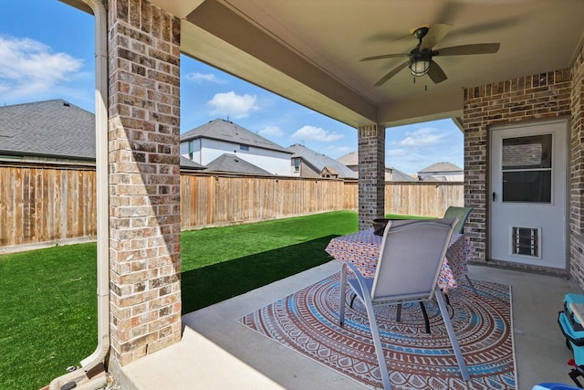 view of patio / terrace featuring a fenced backyard and a ceiling fan