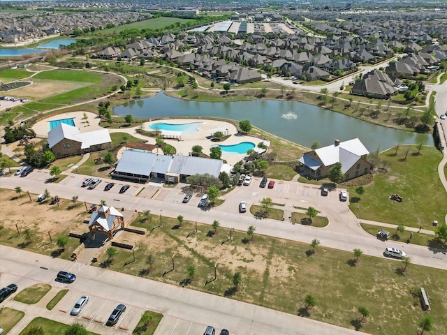 birds eye view of property featuring a residential view and a water view