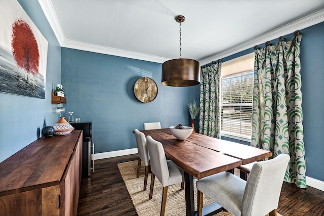 dining area with dark wood-style floors, baseboards, and ornamental molding