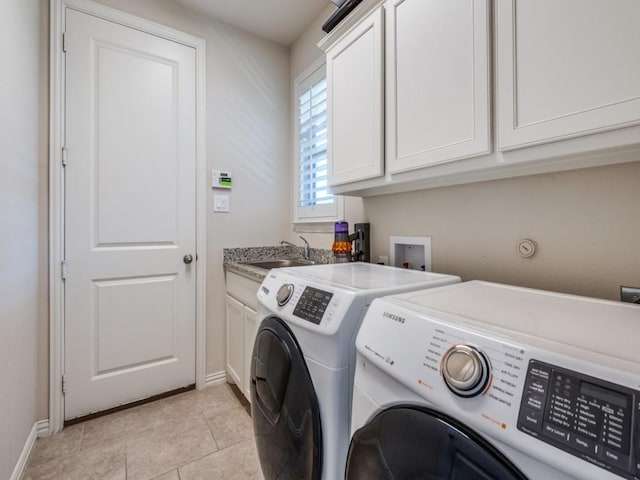 915 Enchanted Wood Dr, Arlington, TX 76005 - clothes washing area featuring baseboards, washer and dryer, light tile patterned flooring, a sink, and cabinet space