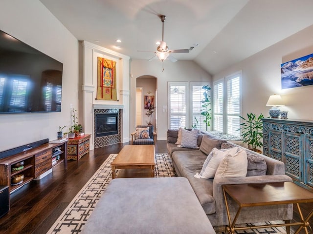 915 Enchanted Wood Dr, Arlington, TX 76005 - living area with wood-type flooring, a premium fireplace, ceiling fan, arched walkways, and vaulted ceiling