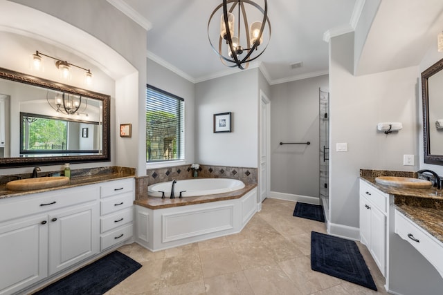 full bath featuring a wealth of natural light, a sink, and an inviting chandelier
