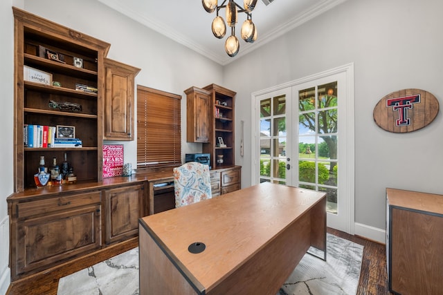 office area featuring a notable chandelier, baseboards, ornamental molding, and french doors