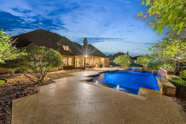 view of swimming pool with a patio area and a pool with connected hot tub