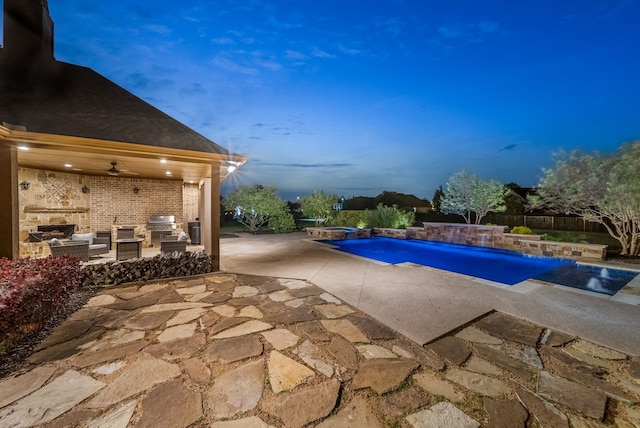pool featuring an outdoor living space, a hot tub, area for grilling, and a patio