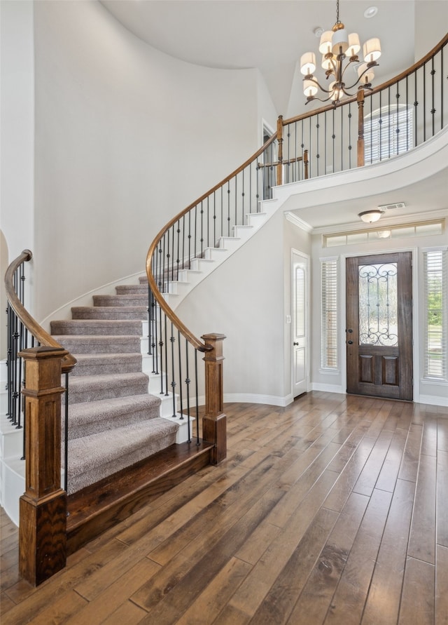 9724 Croswell St, Fort Worth, TX 76244 - entrance foyer with a high ceiling, a chandelier, stairs, hardwood / wood-style flooring, and baseboards