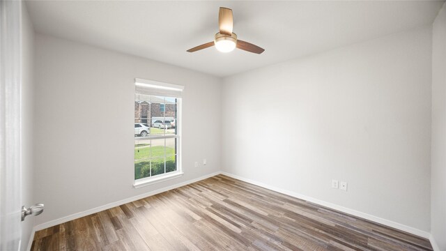 423 Murphy Rd, Burleson, TX 76028 - empty room with wood finished floors, a ceiling fan, and baseboards