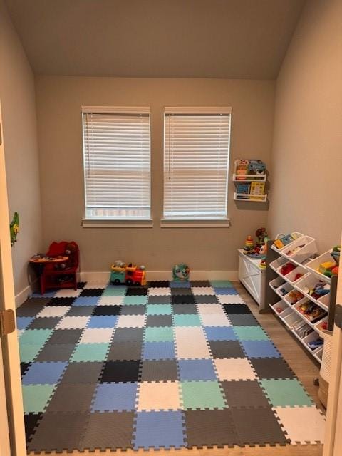 rec room featuring baseboards