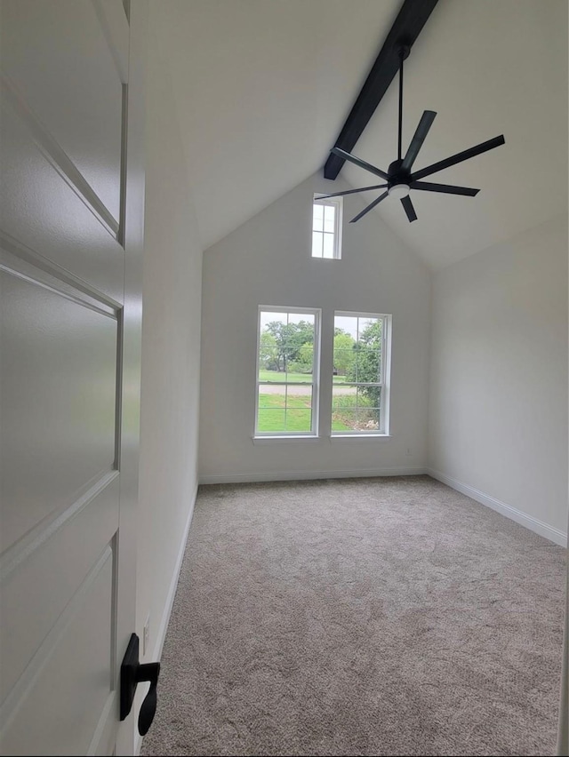 interior space featuring beam ceiling, ceiling fan, high vaulted ceiling, and baseboards