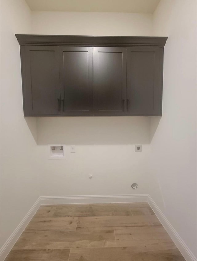 laundry area with hookup for a gas dryer, hookup for an electric dryer, washer hookup, and baseboards