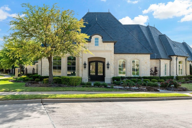 6615 Bluffview Dr, Frisco, TX 75034 - french country style house featuring french doors and stone siding
