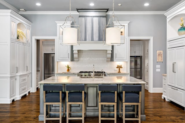 6615 Bluffview Dr, Frisco, TX 75034 - kitchen with multiple ovens, high quality fridge, a kitchen bar, light stone countertops, and backsplash