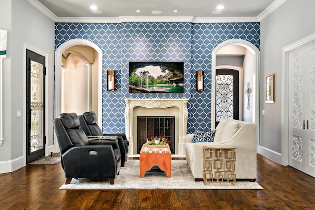 6615 Bluffview Dr, Frisco, TX 75034 - living area with wallpapered walls, arched walkways, an accent wall, and ornamental molding