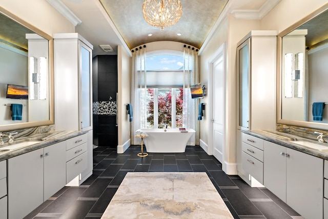 6615 Bluffview Dr, Frisco, TX 75034 - bathroom featuring a freestanding tub, two vanities, a sink, and lofted ceiling