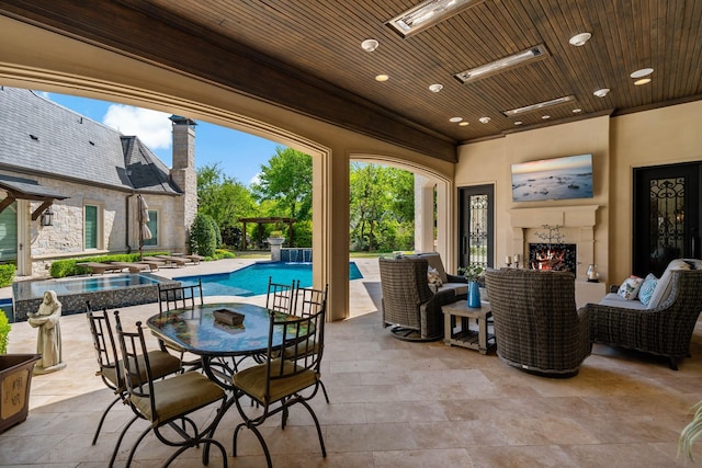 6615 Bluffview Dr, Frisco, TX 75034 - view of patio / terrace with a pool with connected hot tub and outdoor dining area