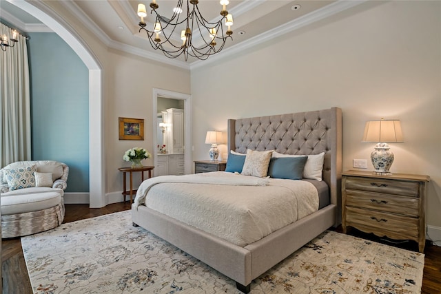6615 Bluffview Dr, Frisco, TX 75034 - bedroom with a chandelier, arched walkways, wood finished floors, crown molding, and a raised ceiling