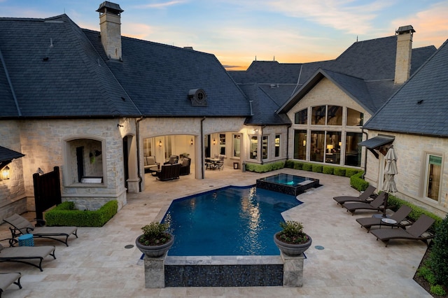 6615 Bluffview Dr, Frisco, TX 75034 - view of pool featuring a patio area, an outdoor living space, and a pool with connected hot tub
