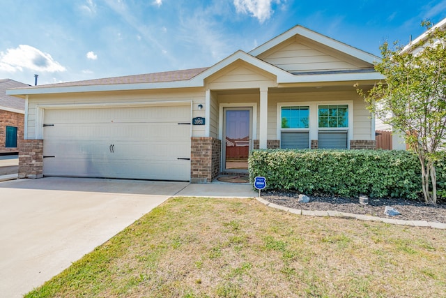 view of front of home featuring concrete driveway, a garage, a front lawn, and brick siding