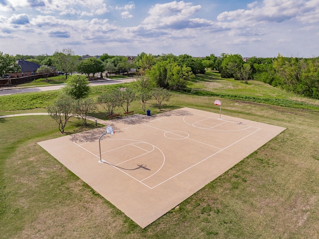 view of sport court featuring a yard and community basketball court