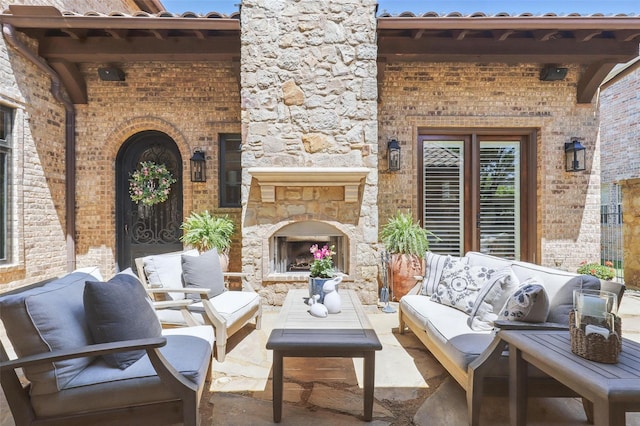 view of patio / terrace featuring an outdoor living space with a fireplace