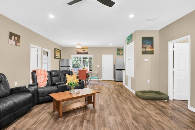 411 Johnson St, Longview, TX 75602 - living area with wood finished floors, baseboards, ceiling fan, and recessed lighting